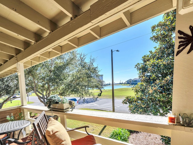 exterior space featuring a water view and a porch