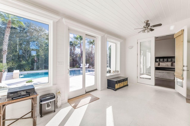 sunroom / solarium featuring ceiling fan, french doors, and wooden ceiling