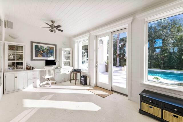 interior space featuring plenty of natural light, wooden ceiling, and ceiling fan