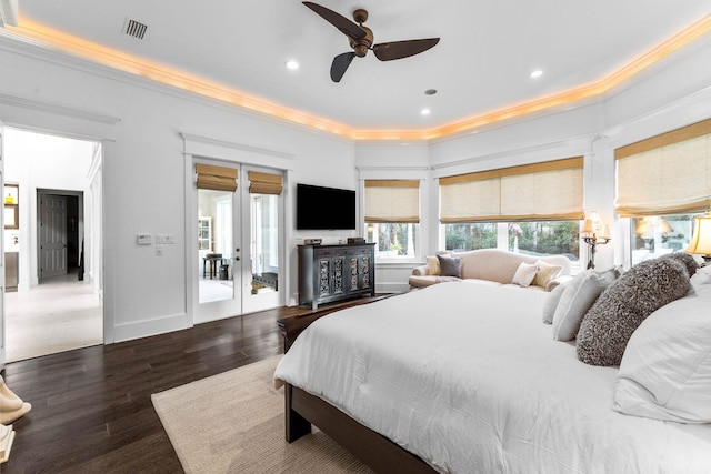 bedroom with ceiling fan, crown molding, dark wood-type flooring, and french doors