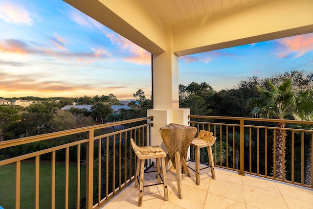 view of balcony at dusk