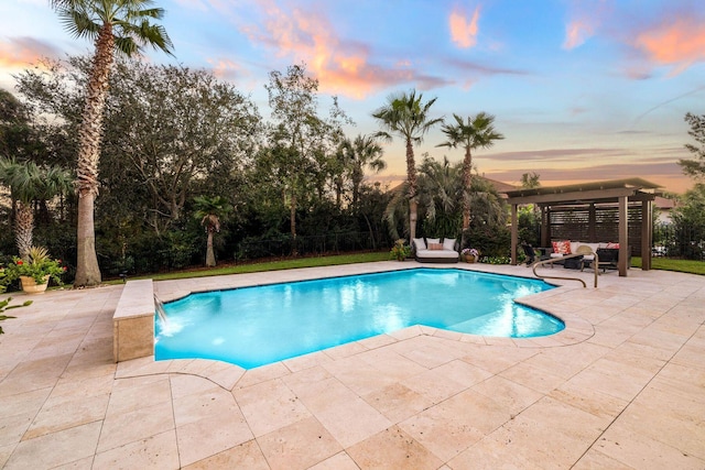 pool at dusk with a patio