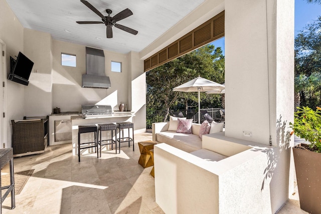 view of patio / terrace with grilling area, an outdoor living space, ceiling fan, and exterior kitchen