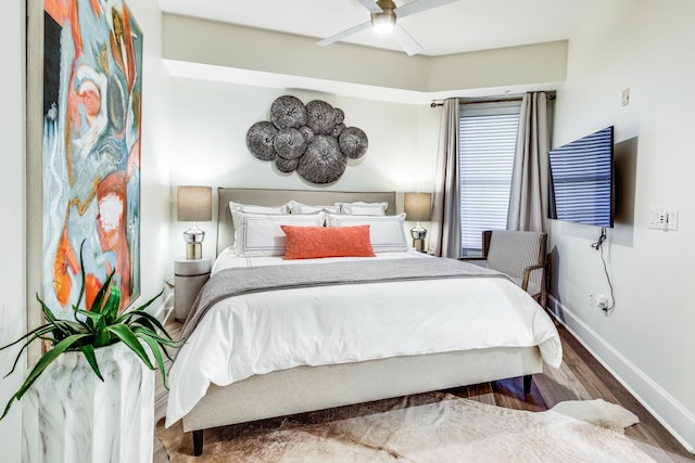 bedroom featuring ceiling fan and wood-type flooring