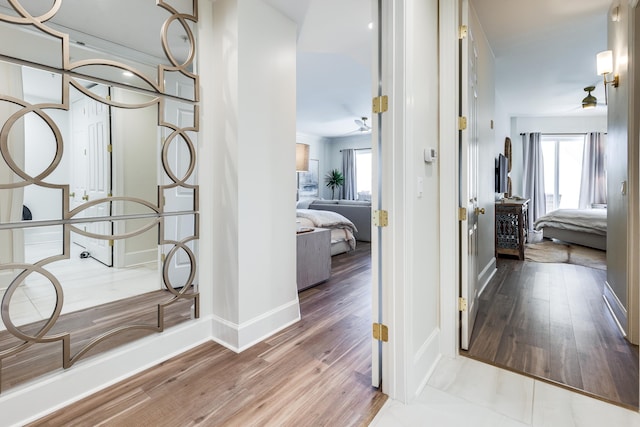 corridor featuring hardwood / wood-style floors