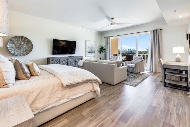 bedroom with access to exterior, hardwood / wood-style flooring, ceiling fan, and ornamental molding