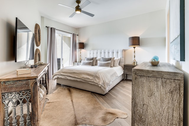 bedroom featuring ceiling fan and light hardwood / wood-style floors