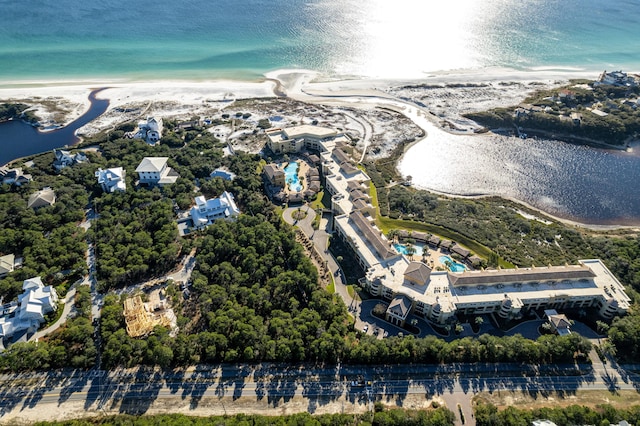 drone / aerial view featuring a beach view and a water view