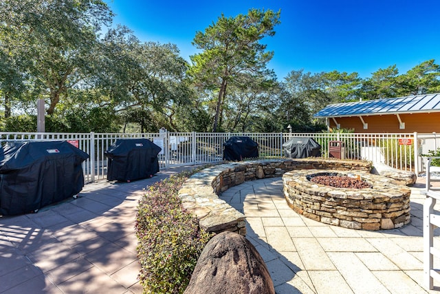 view of patio featuring grilling area and an outdoor fire pit