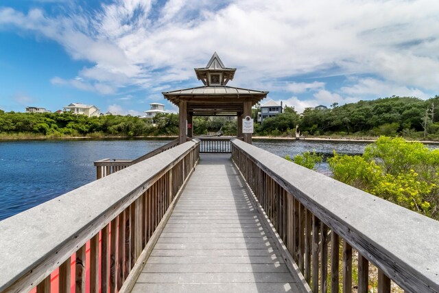 view of home's community with a gazebo and a water view