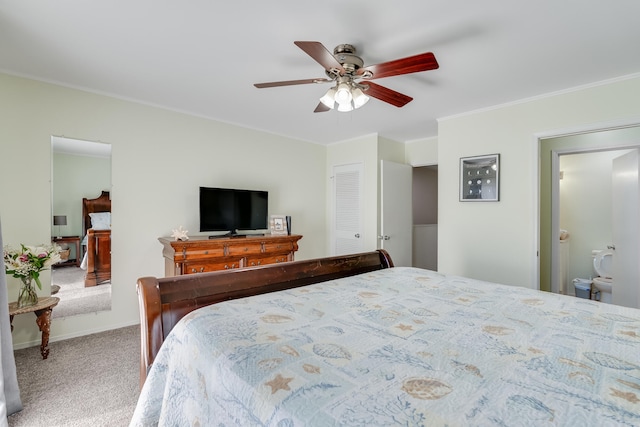 bedroom featuring carpet flooring, ceiling fan, and ensuite bathroom