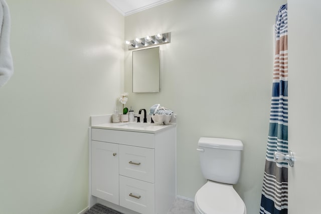 bathroom featuring vanity, toilet, and ornamental molding