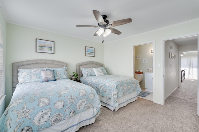 bedroom featuring ensuite bath, ceiling fan, and light colored carpet