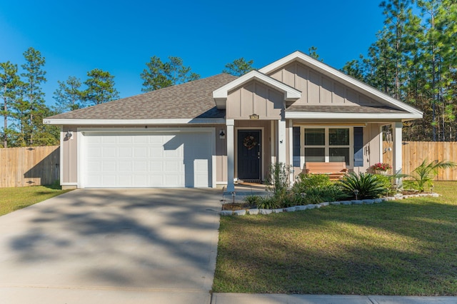 view of front of home with a garage and a front lawn