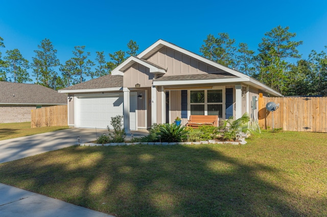 view of front facade with covered porch, a garage, and a front lawn