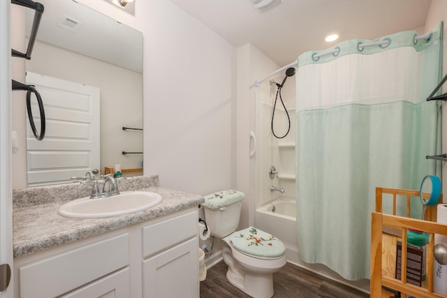 full bathroom featuring vanity, toilet, wood-type flooring, and shower / tub combo with curtain