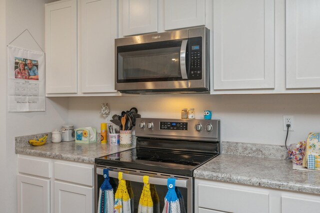 kitchen featuring white cabinets and stainless steel appliances