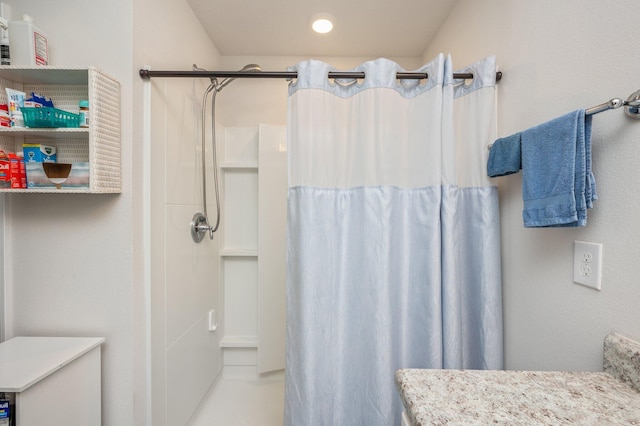 bathroom with vanity and curtained shower