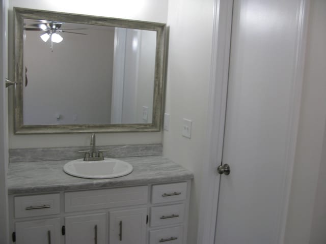 bathroom with vanity and ceiling fan