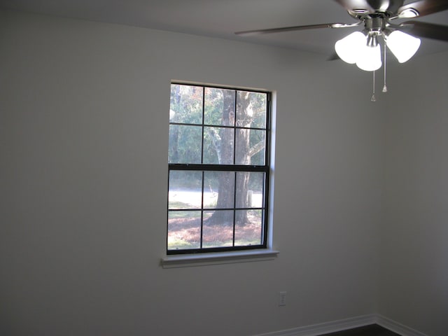 unfurnished room with ceiling fan