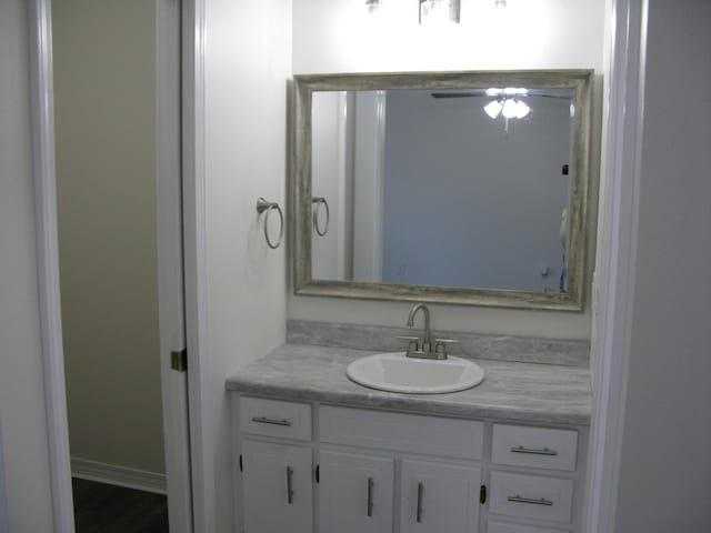 bathroom featuring ceiling fan and vanity