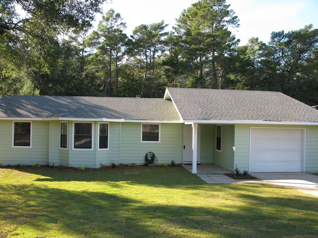 single story home with a front yard and a garage