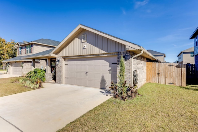 view of front of home featuring a front yard and a garage