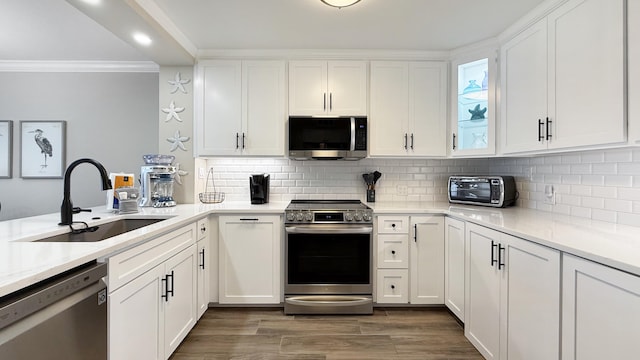 kitchen featuring white cabinetry, sink, and stainless steel appliances