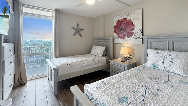 bedroom featuring ceiling fan and dark hardwood / wood-style flooring