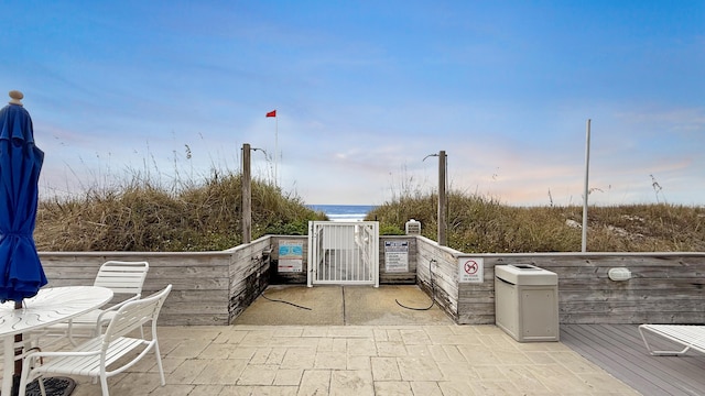 view of patio with a water view