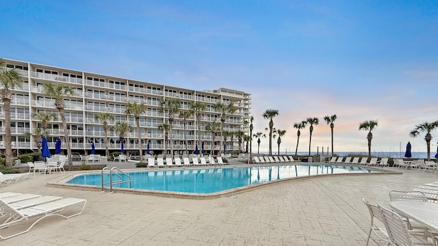 view of swimming pool featuring a patio area