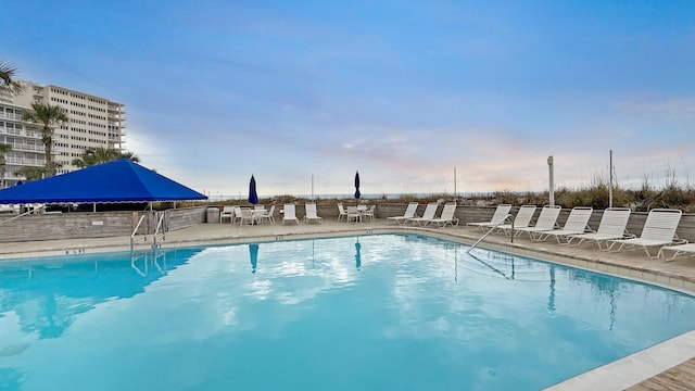 view of swimming pool featuring a patio