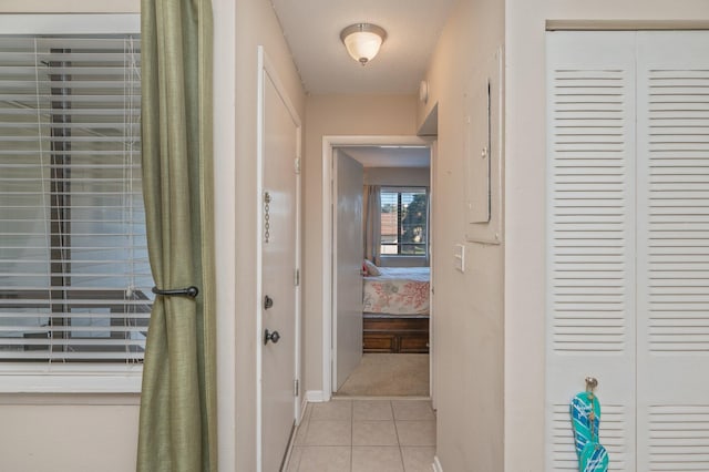 hall with light tile patterned flooring