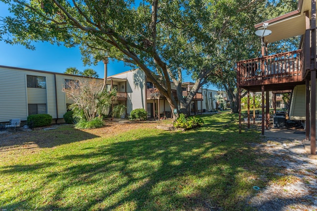 view of yard with a wooden deck