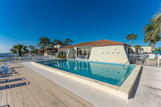 view of swimming pool with a patio