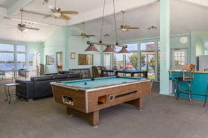 rec room with vaulted ceiling with beams and pool table