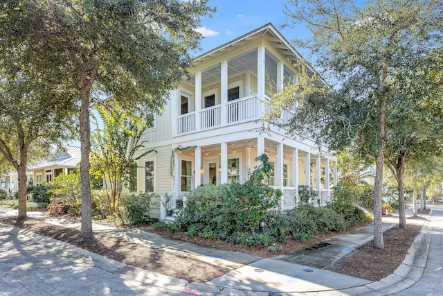 view of front of house featuring a balcony