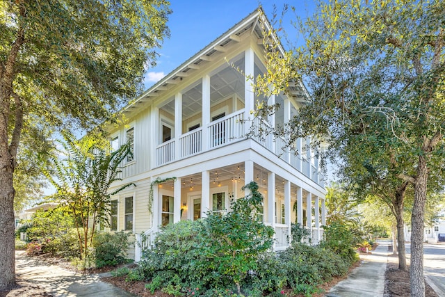 view of side of property with a balcony