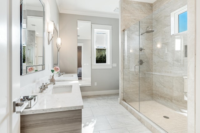 bathroom with vanity, a shower with shower door, and crown molding