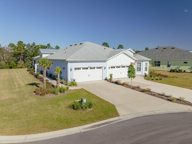 single story home with a front yard and a garage