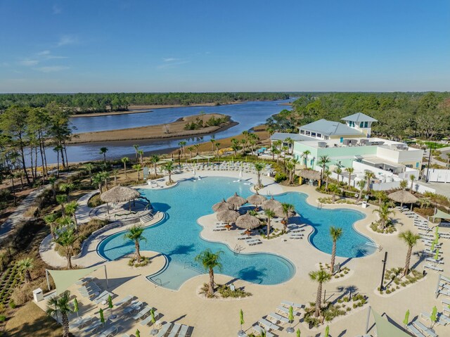 view of pool featuring a water view