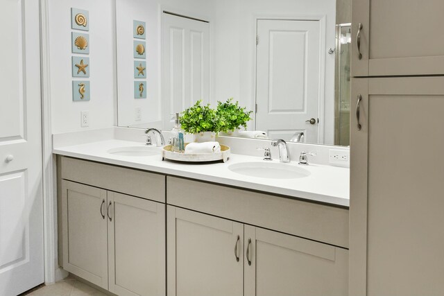 bathroom with vanity and tile patterned floors