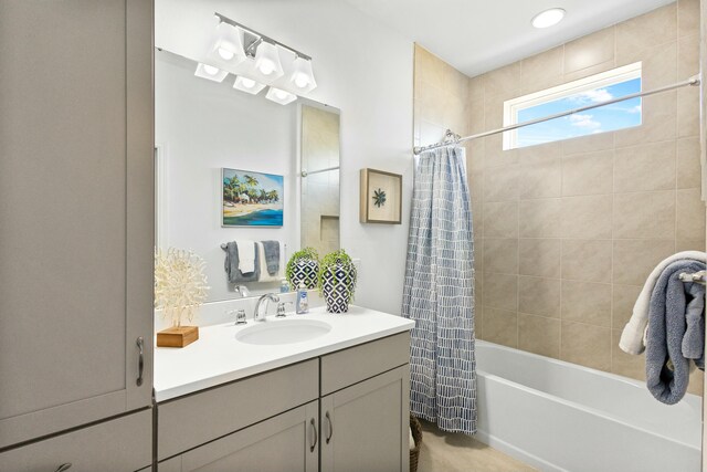 bathroom featuring vanity and shower / bath combo with shower curtain