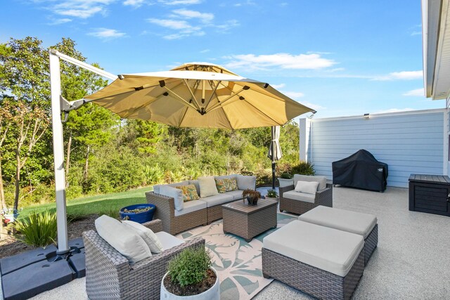 view of patio with area for grilling and an outdoor hangout area