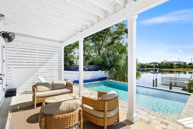 view of pool featuring a patio area, a fenced in pool, a fenced backyard, and a water view