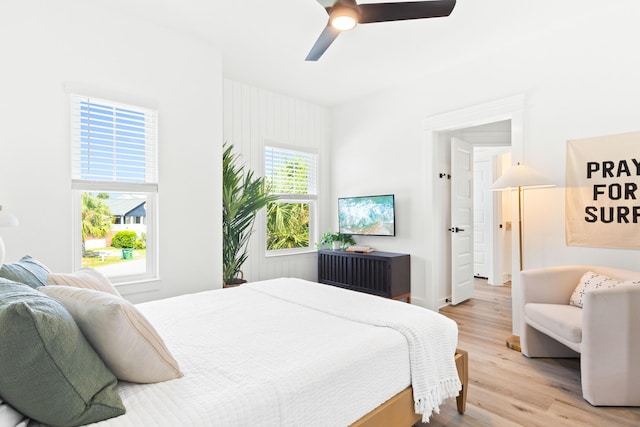 bedroom featuring light wood-type flooring and ceiling fan