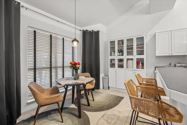 dining area featuring light tile patterned flooring