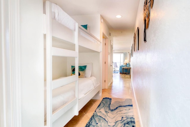 corridor featuring light tile patterned flooring