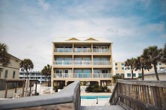 view of property featuring a community pool