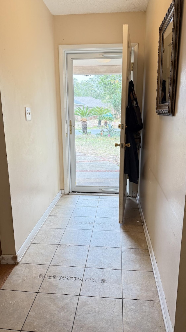 entryway featuring light tile patterned flooring